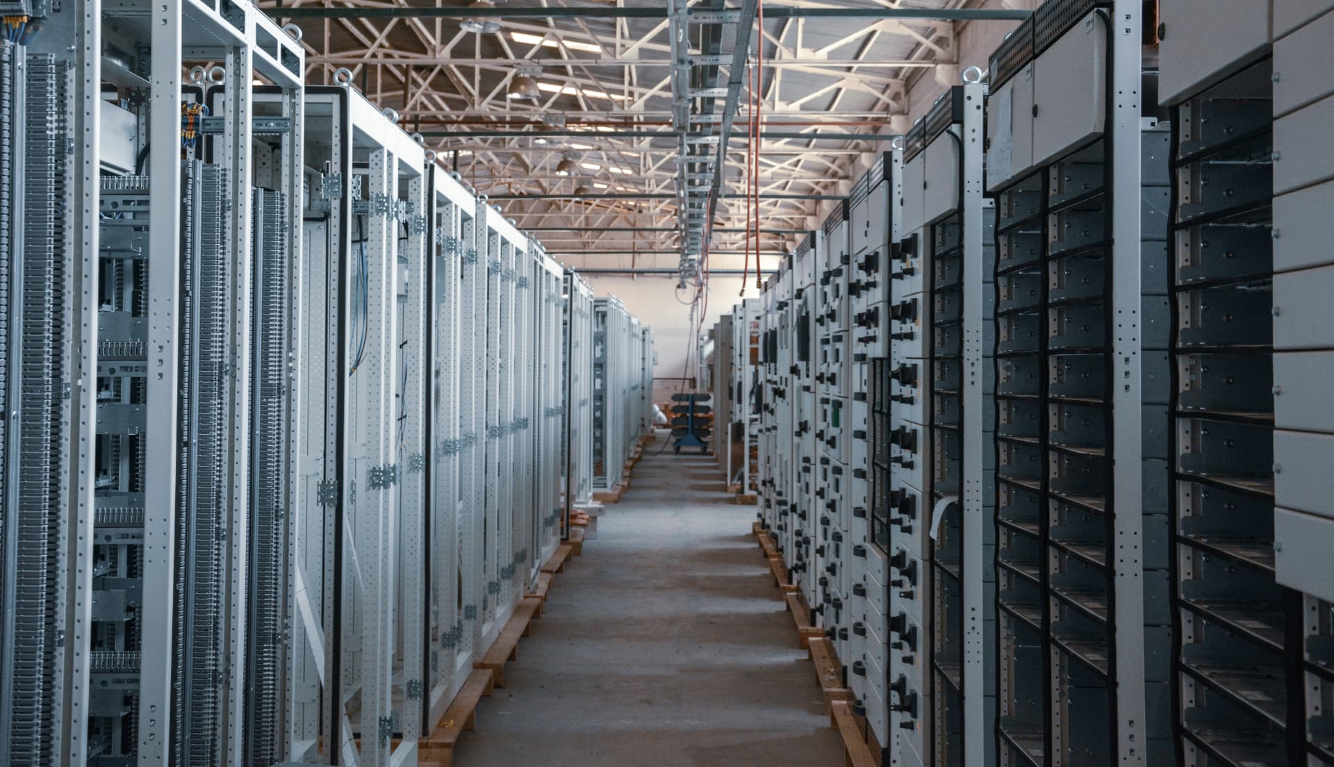 Aisle of electrical control cabinets inside a technical facility